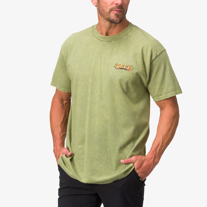 Menโs Lonnie Tee in moss stone mineral wash facing forward showing chest logo, beach-inspired comfortable apparel.
