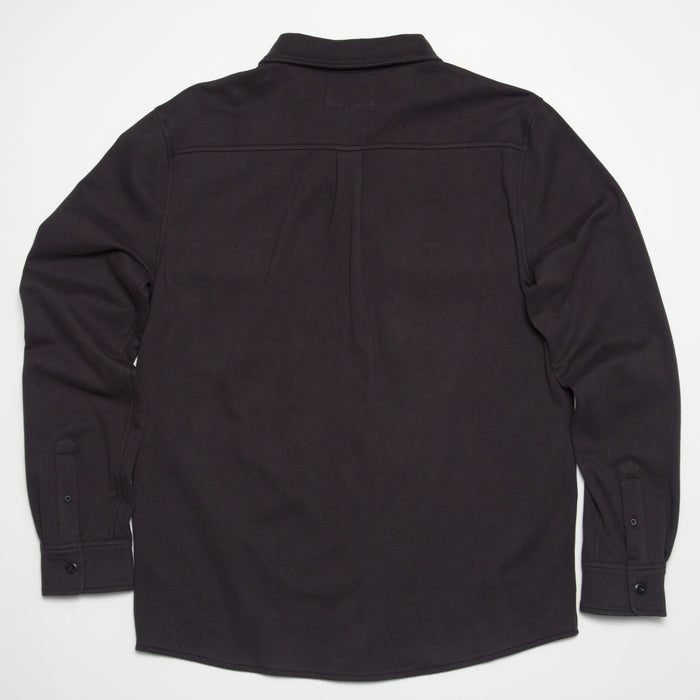 Raymond Ls Shirt showing back view in dark color, surf-inspired comfort apparel designed for beach and active lifestyles.