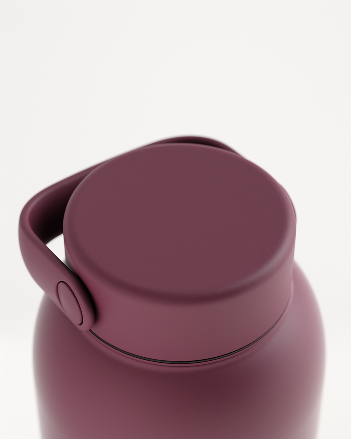 Metal Spout Lid on maroon insulated bottle, sophisticated design.