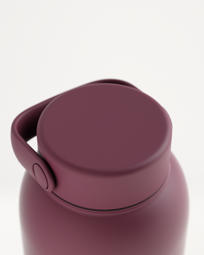 Metal Spout Lid on maroon insulated bottle, sophisticated design.
