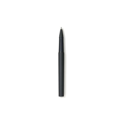 Black ballpoint pen open on a white background