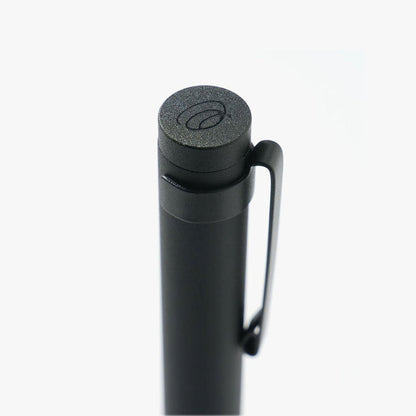 Black pen with a textured cap on a white background