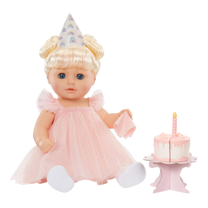 Annabell sitting by her cake