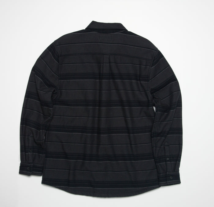 Bartlett Woven Jacket back view showing textured black striped beach-inspired comfort apparel with long sleeves and collar