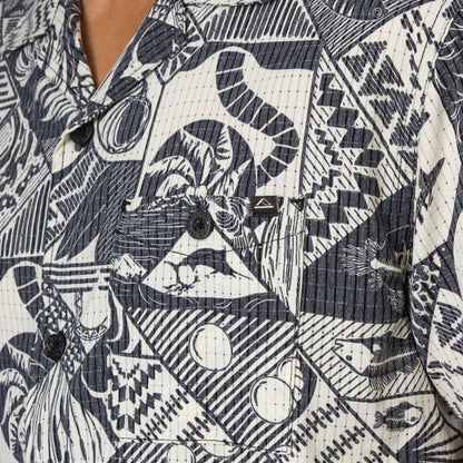 Close-up of the Beckham Camp Shirt showing textured black and white patterned fabric with button details for men’s beachwear