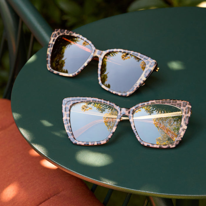 lifestyle - group shot of diff eyewear becky ii leopard tortoise sunglasses and prescription frames