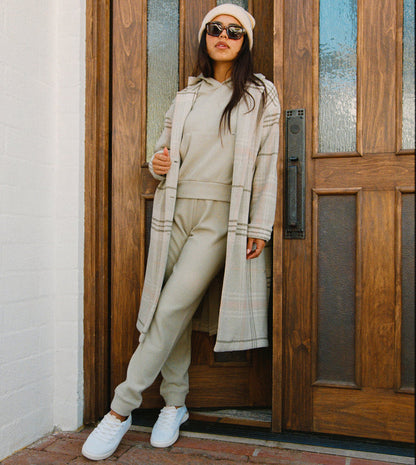 Woman wearing Tina Thermal Jogger in desert sage, front view with soft-rebound cushioning and arch support shoes.