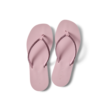 Bliss Bling Fling women's pink flip flops top view, facing upward, with soft-rebound cushioning and arch support for beach comfort.