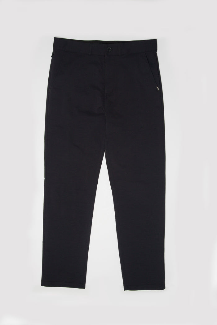 Front view of men's Carrick Stretch Pant in black, designed for comfort and active beach lifestyles.