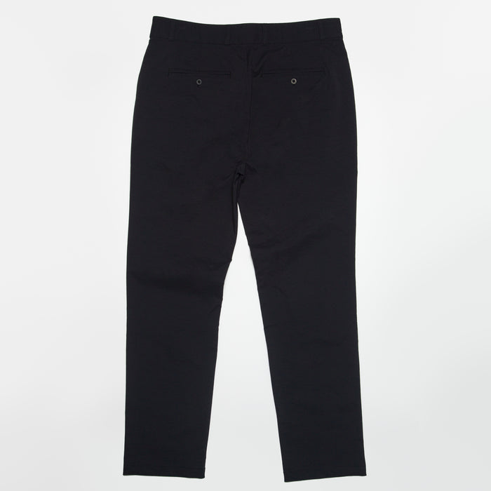 Back view of black Carrick Stretch Pant for men, highlighting durable fabric and tailored fit with comfortable stretch.