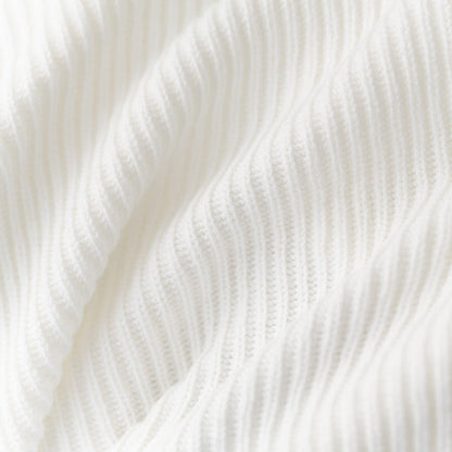 Close up of chunky knit fabric: A warm white