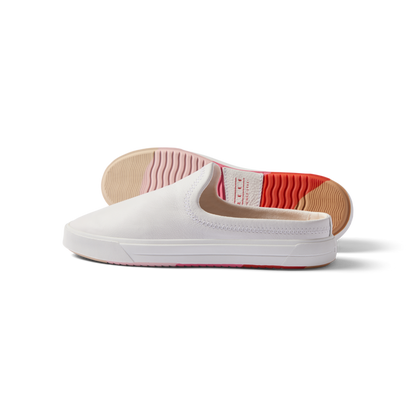 Coastal Breeze women's white slip-on shoe facing left with heel view showing water-friendly sole and arch support.
