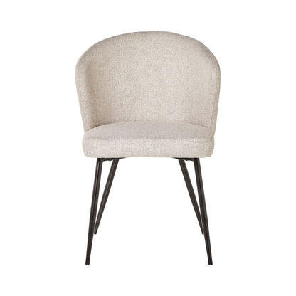 The Cole Dining Chair Clay showcases clay-coloured upholstery with a rounded backrest and black metal legs, perfect for modern interiors. Photographed against a white background.