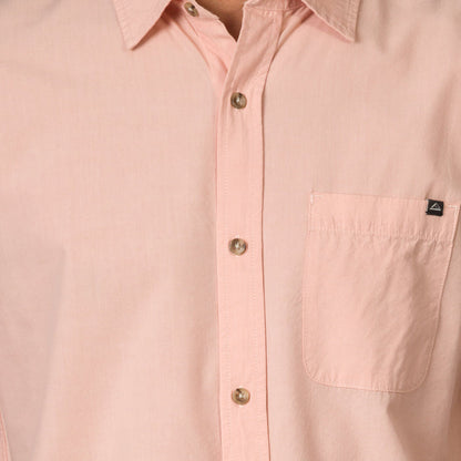 Close-up of a light pink Collins Ss Woven Shirt showing front buttons and chest pocket with surf-inspired design.