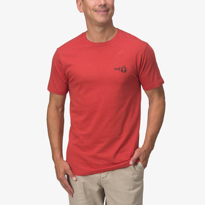 Man wearing a cinnabar red Cowmaid Tee facing forward, featuring soft fabric and a small chest logo on the left side.