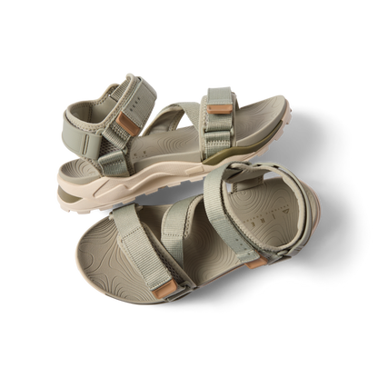 Top view of men's Cross-Shore sandal in tan with adjustable straps, cushioned sole, and arch support facing right