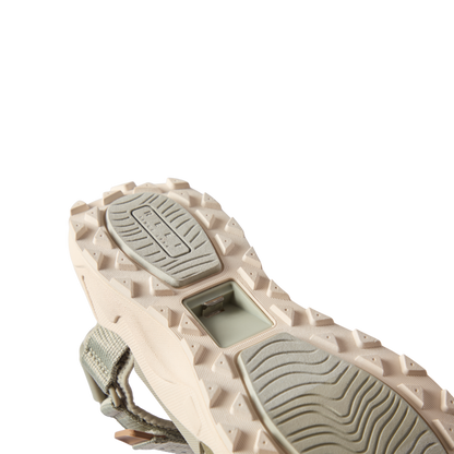Cross-Shore men's shoe sole facing upward showing textured grip and built-in bottle opener for beach and active lifestyles.