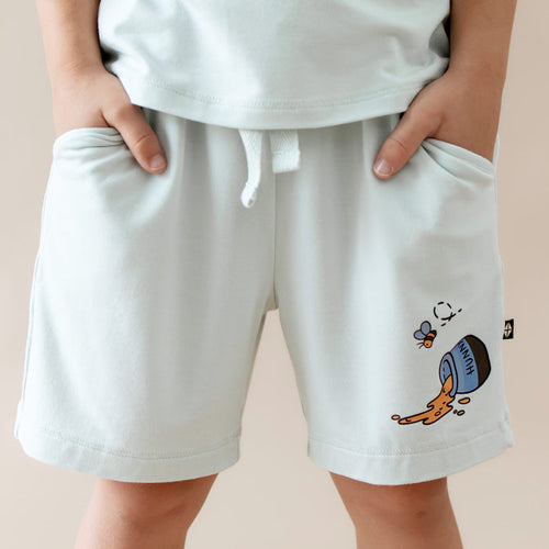 Close up of the Drawstring Short in Winnie the Pooh on Dew shown on a model