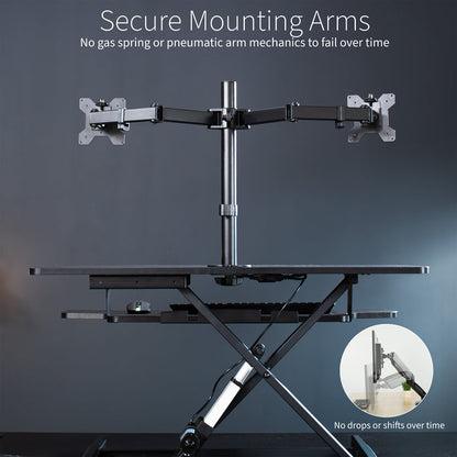 Sit to stand desk riser and dual monitor mount with electric height adjustment.