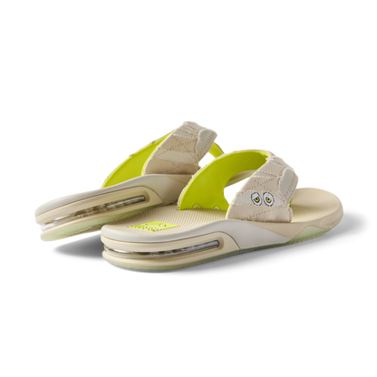 Pair of beige Fanning sandals facing right showing heel and cushioned arch support, designed for beach comfort and durability.