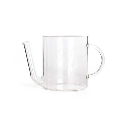 Glass fat separator for cooking with spout on white background