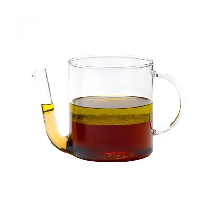 Glass fat separator with cooking fat on white background