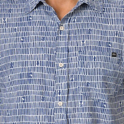 Close-up of the chest area of the Ferris Classic Shirt in blue patterned fabric with button closure and surf-inspired design.