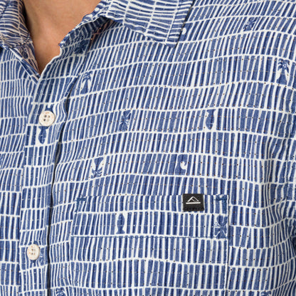 Close-up of men's Ferris Classic Shirt pocket and upper chest in blue patterned beach-inspired fabric showing button details.