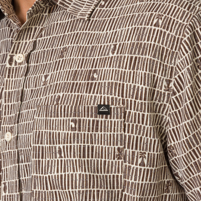 Close-up of chest pocket on Ferris Classic Shirt in brown patterned fabric, designed for men's beach-inspired comfort apparel.