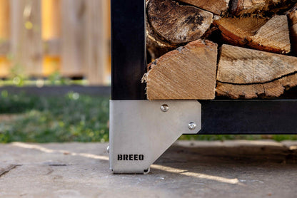 A closeup of the stainless steel feet on the firewood rack.