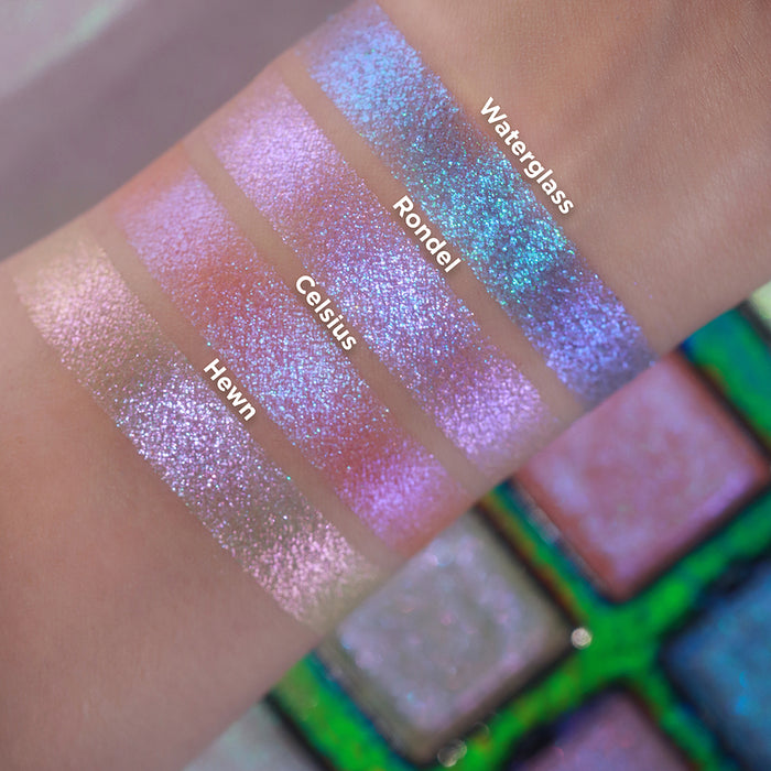 Arm swatches of all four shadows from the Glow Quad on fair skin tone. Open Glow Quad in the background.
