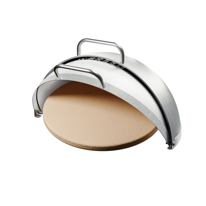 Studio image of the Breeo Dome Pizza Oven attachment for X24 fire pits, shown open to display the round ceramic pizza stone inside. The stainless steel dome includes a built-in temperature gauge and two handles for easy lifting.