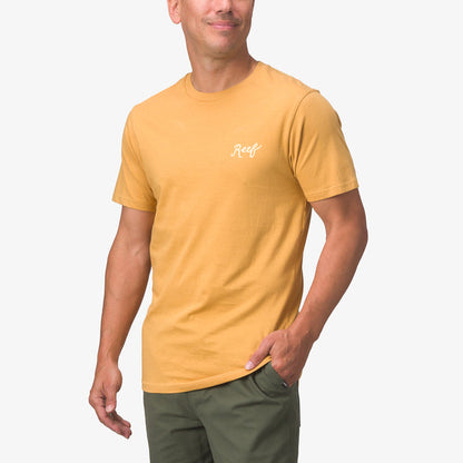 Man modeling a honey mustard Jacob Tee facing forward, highlighting its surf-inspired, comfortable, beach-ready style.