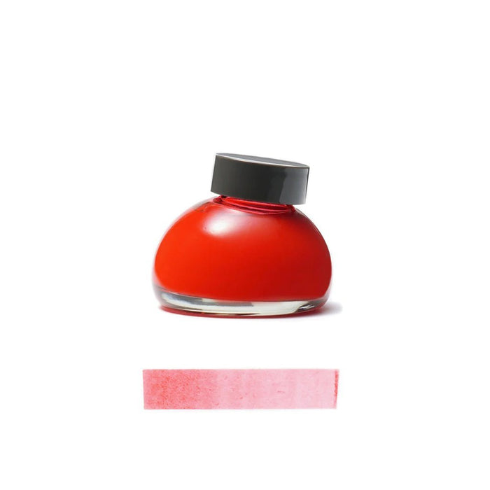 Red Po ink bottle with black cap on a white background