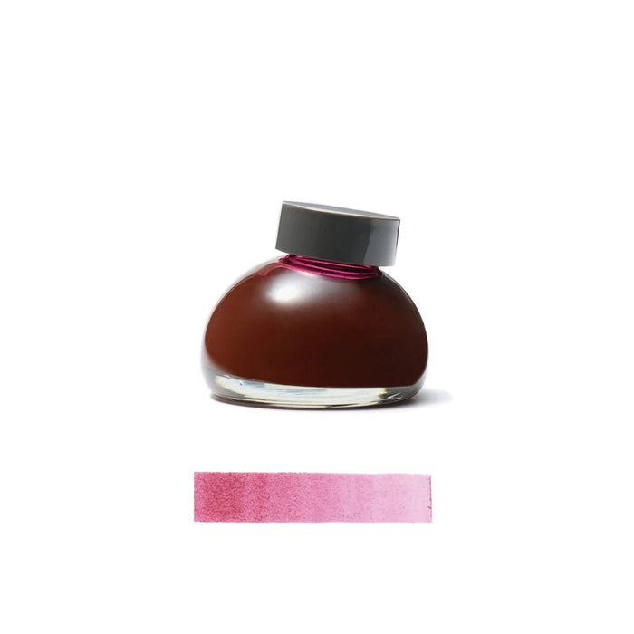 Burgundy Tototo Ink bottle with a gray cap on a white background