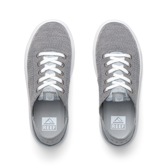 Top view of grey Kids Neptune sneakers with breathable knit upper, white laces, and lightweight cushioned sole facing forward