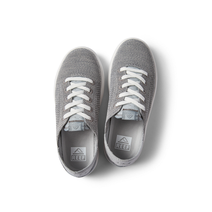 Top view of gray Kids Neptune sneakers with white laces, knit upper, and Reef logo insoles, designed for comfort and the beach.