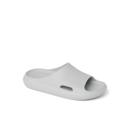 Kids Rio Slide in light grey facing right, close-up of front and side, breathable, water-friendly, cushioned slides for kids.