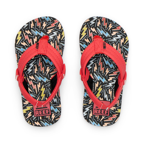 Little Ahi boys flip flops with red straps facing upward, featuring colorful bolt pattern, soft cushioning, and arch support.