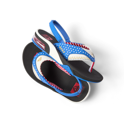 Little Fanning boys' sandals with patriotic blue strap facing right, showing cushioned footbed and heel strap close-up.
