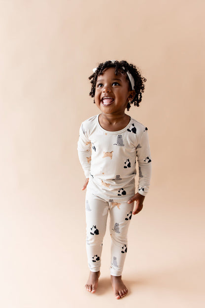 Smiling girl wearing the Long Sleeve Pajamas in Fluffy Cat