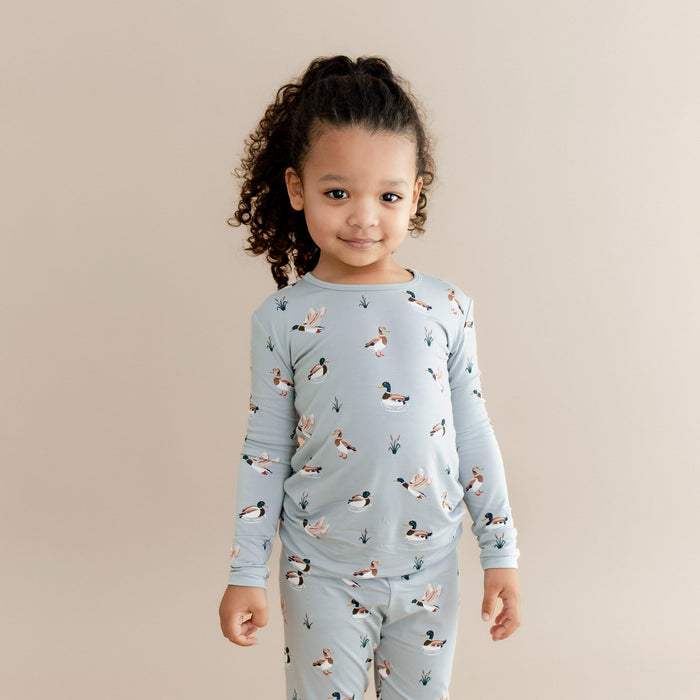 Close up of young girl wearing the Long Sleeve Pajamas in Mallard Duck