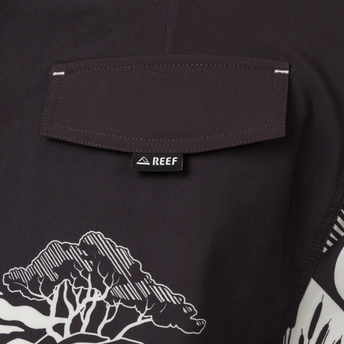 Close-up of the back pocket on the Marshall Boardshort showing water-friendly fabric and REEF branding tag.