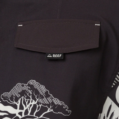 Close-up of the back pocket on the Marshall Boardshort showing water-friendly fabric and REEF branding tag.