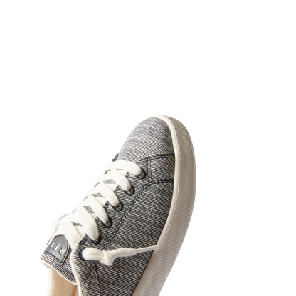 Neptune Alana women’s sneaker facing left, close-up of front and laces, surf-inspired comfort and durable design.