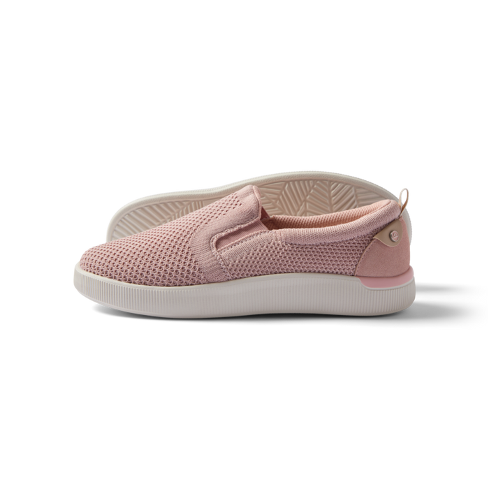 Neptune Elyse women's pink slip-on sneaker facing left with breathable mesh, cushioning, and arch support for beach comfort.