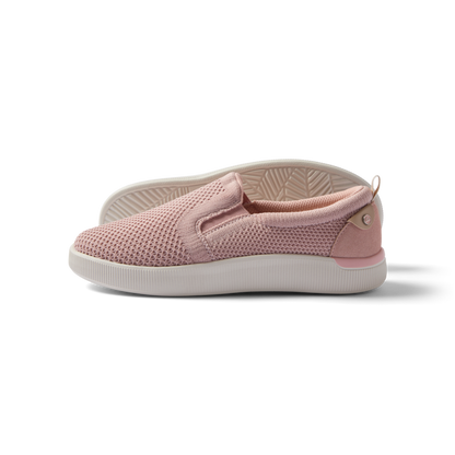 Neptune Elyse women's pink slip-on sneaker facing left with breathable mesh, cushioning, and arch support for beach comfort.