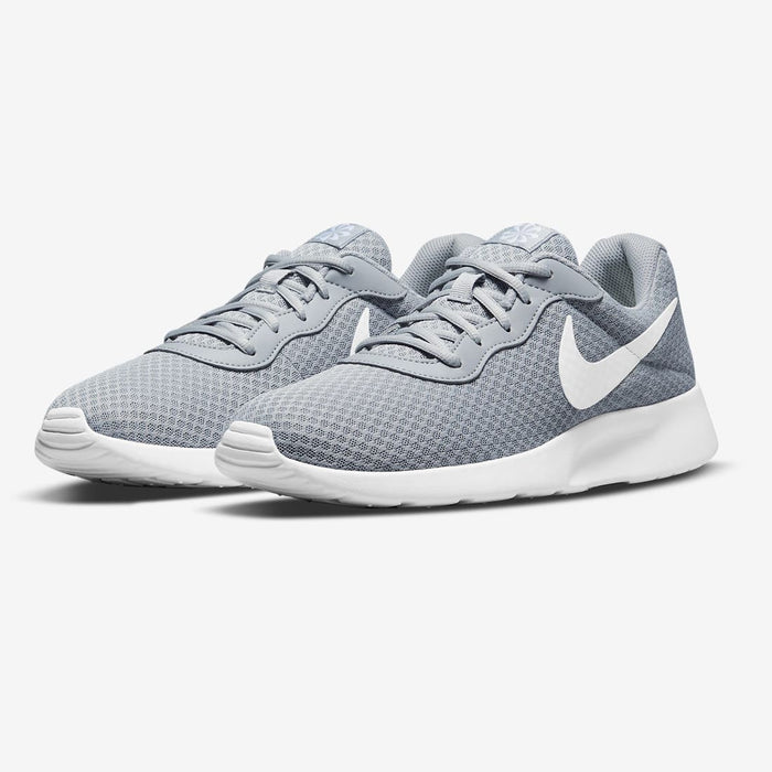 Nike Tanjun grey training shoe both shoes