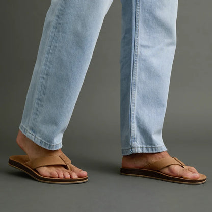 Ojai Classic tan sandals on feet facing right, showing soft-rebound cushioning and anatomical arch support for comfort.