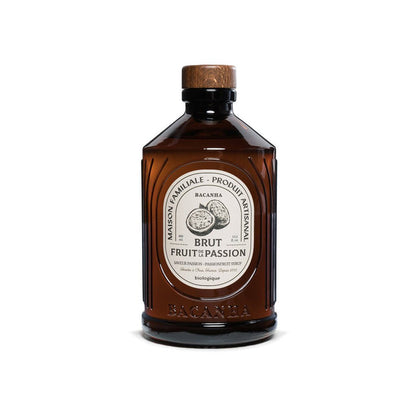 Brown bottle of Passionfruit syrup with a white label on a white background